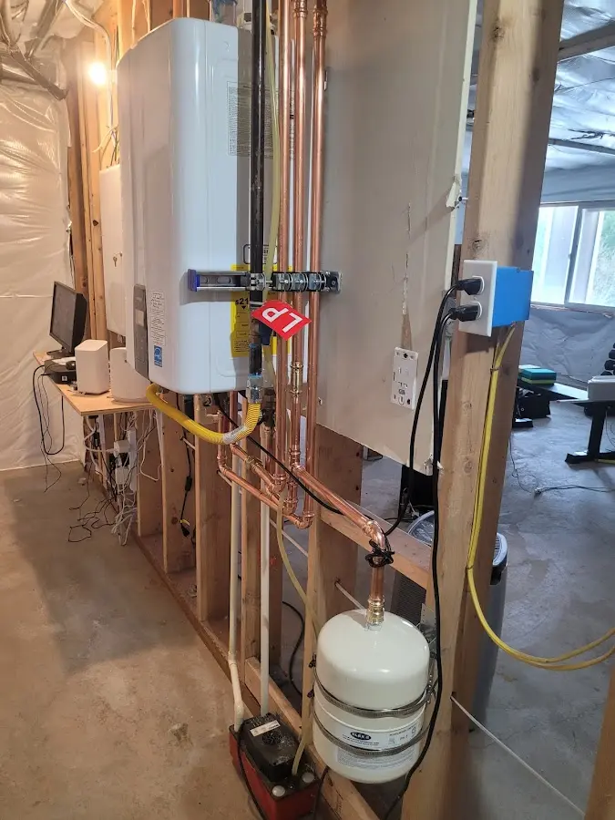 Licensed plumber repairing a kitchen sink in Manlius